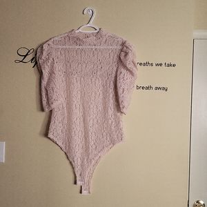 Beige colored, bodysuit lace top